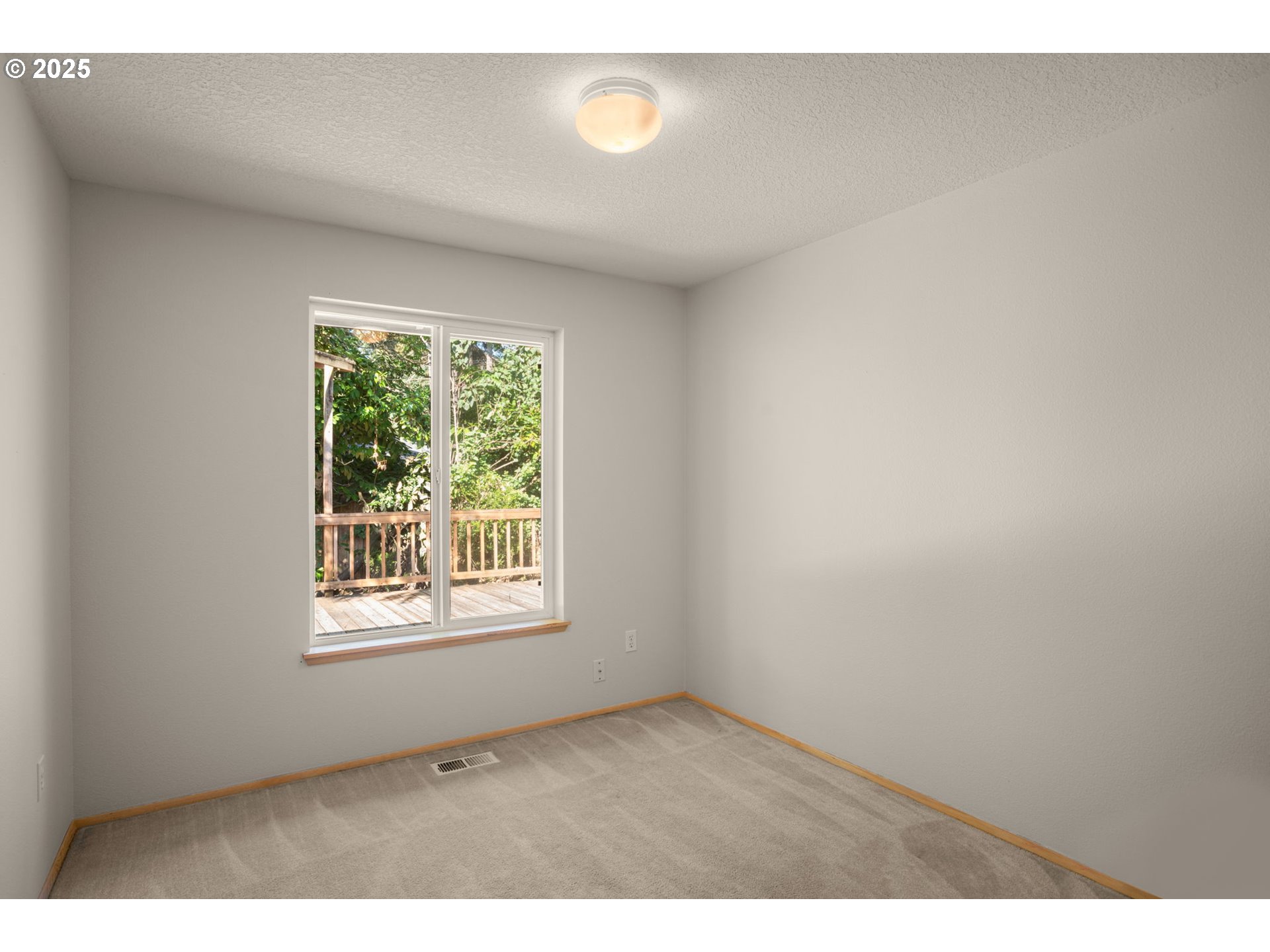 8123 Southwest Hearthside Court Portland, OR 97223 - Photo 16 of 19 a view of an empty room with a window