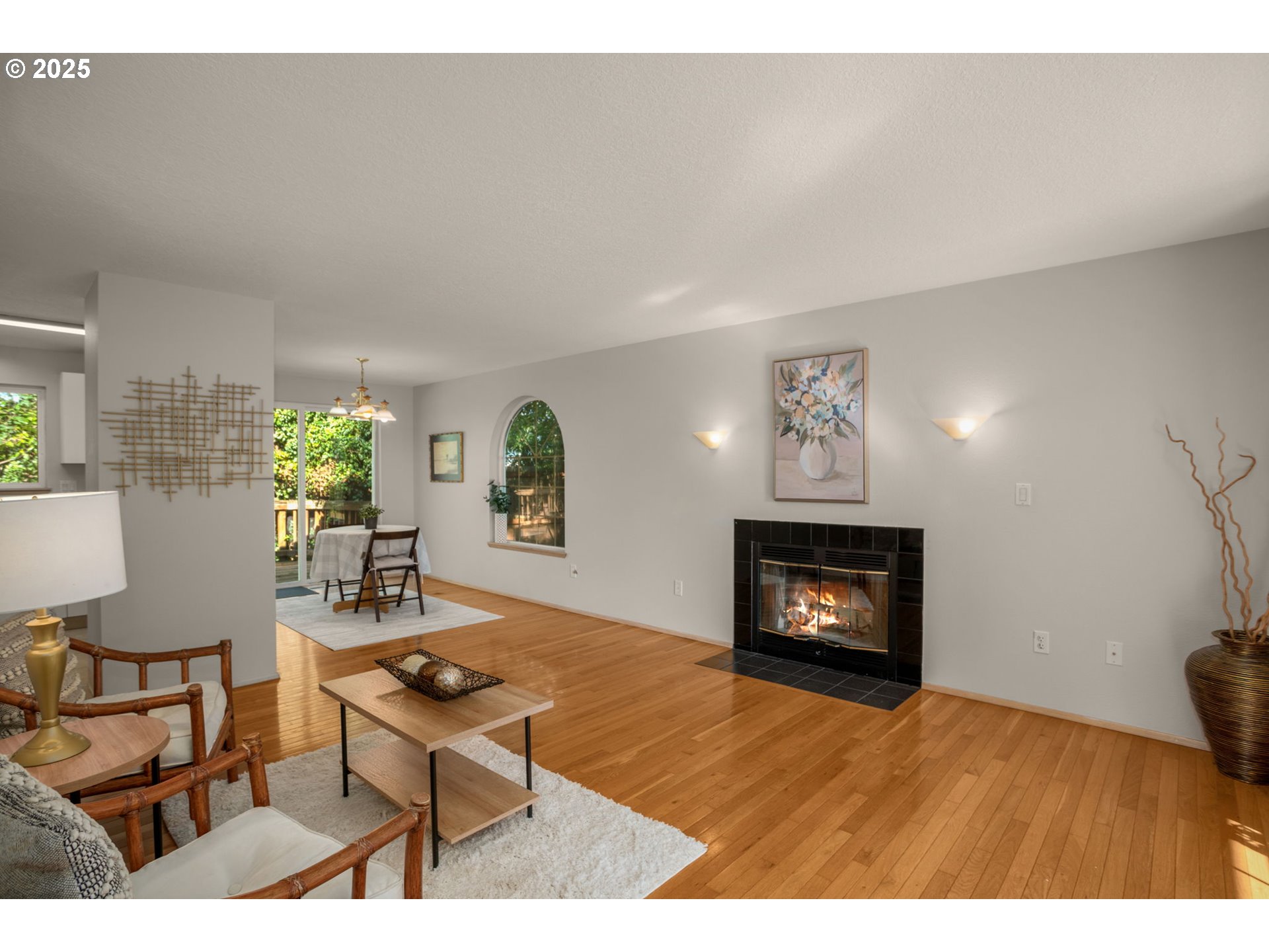 8123 Southwest Hearthside Court Portland, OR 97223 - Photo 4 of 19 a living room with furniture a fireplace and a flat screen tv
