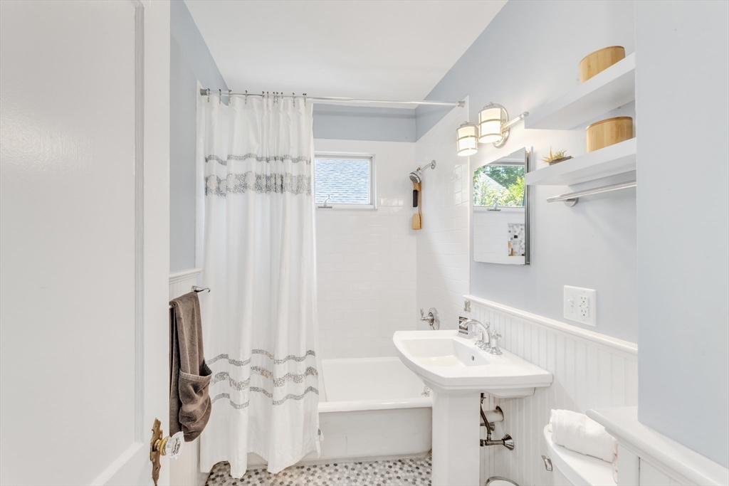 32 Cotuit Street Boston, MA 02132 - Photo 12 of 26 a bathroom with a sink and a mirror