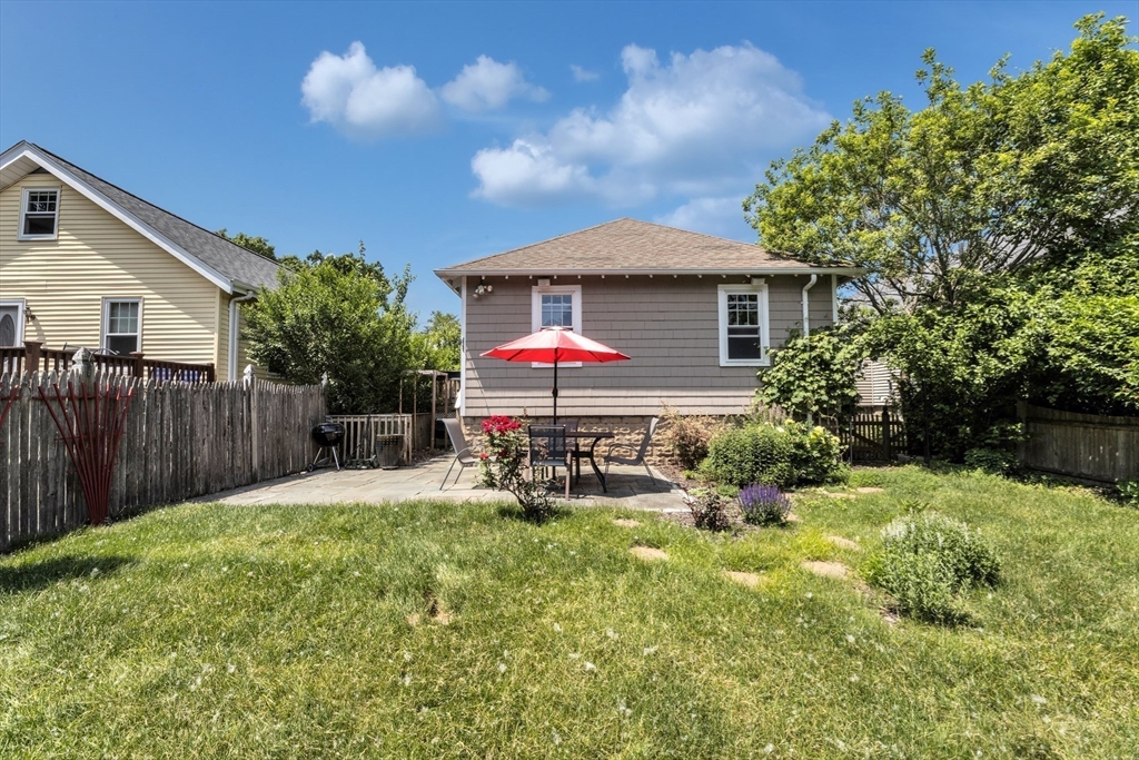 32 Cotuit Street Boston, MA 02132 - Photo 19 of 26 a house view with a seating space and garden