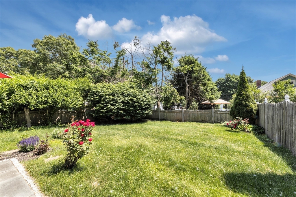 32 Cotuit Street Boston, MA 02132 - Photo 20 of 26 a view of a garden with a fountain