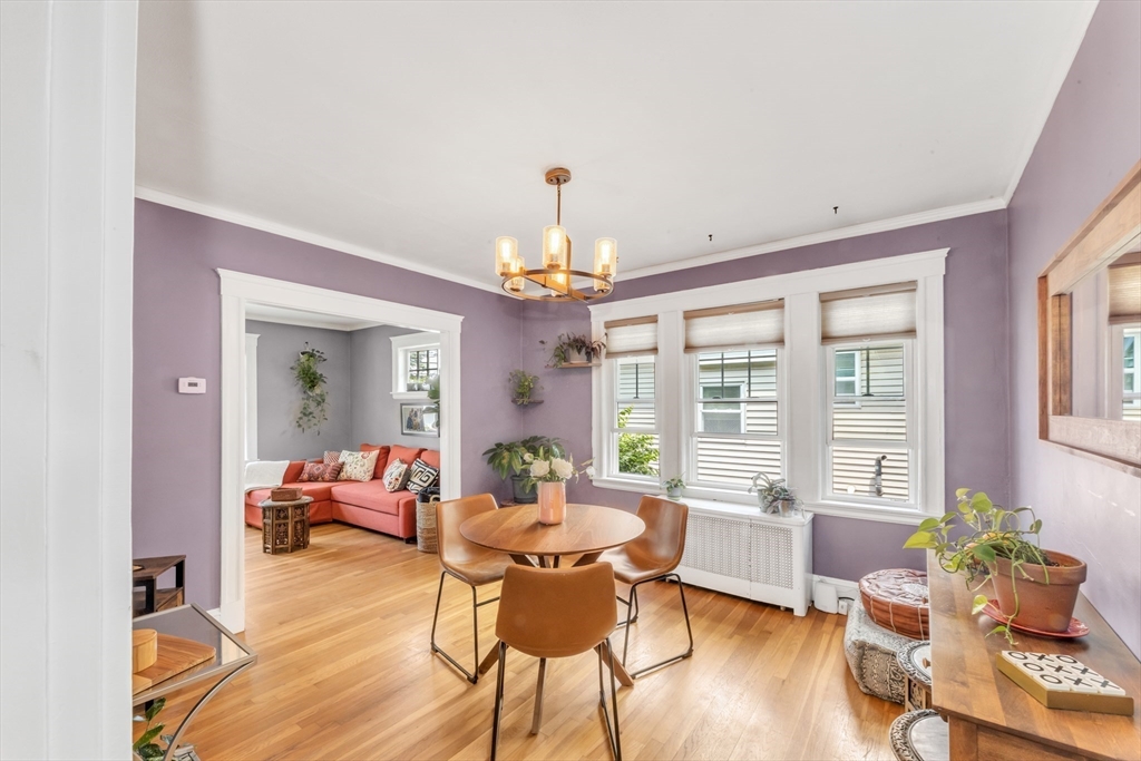 32 Cotuit Street Boston, MA 02132 - Photo 8 of 26 a view of a dining room with furniture a chandelier and wooden floor