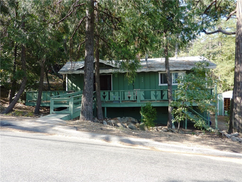744 Forest Shade Road Crestline, CA 92325 - Photo 1 of 1 a front view of a house with a garden