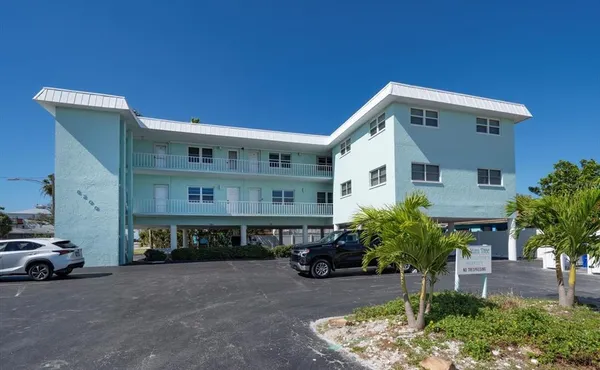 a view of a car park in front of house