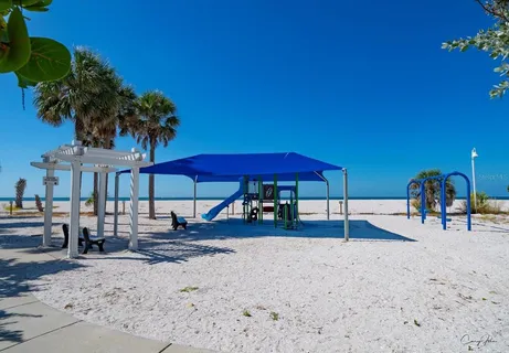 a picture of a bench in front of a wall