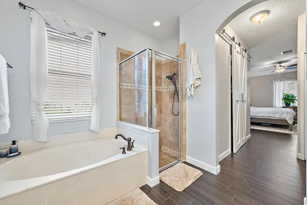 a spacious bathroom with a double vanity sink mirror and