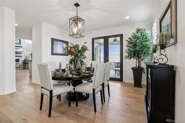 a view of a dining room with furniture window and wooden floor