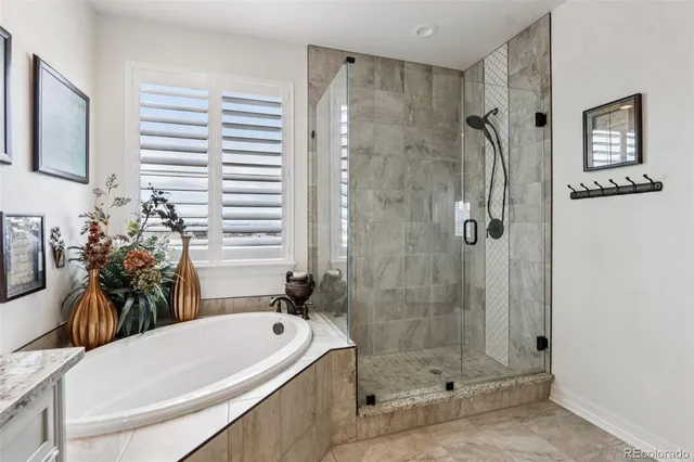 a bathroom with a tub and a shower
