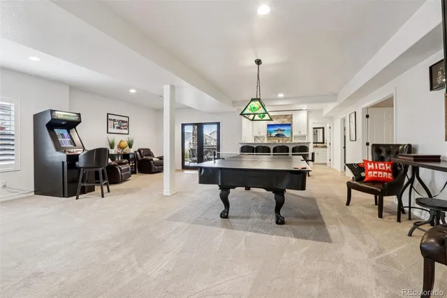 a workspace with furniture and a chandelier
