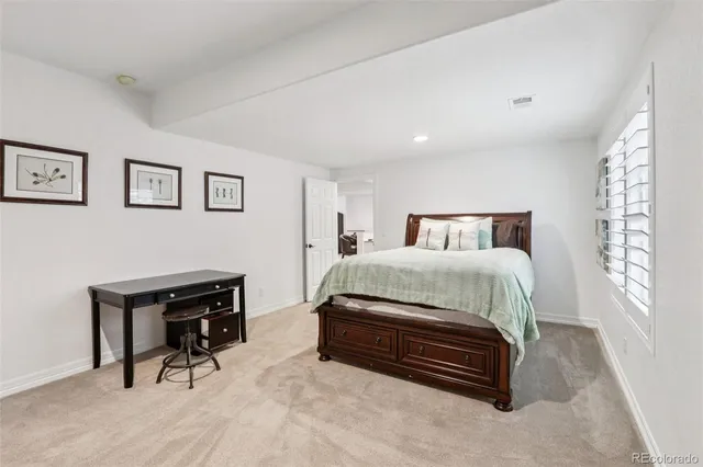 a bedroom with a bed and a table in it