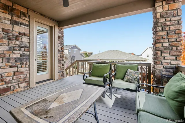 a bedroom with furniture and a wooden floor