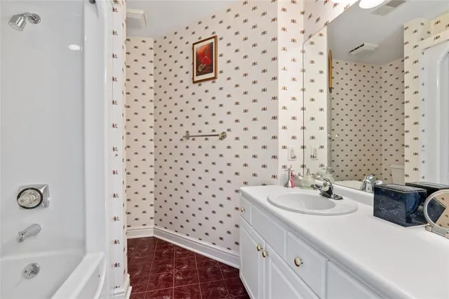 a bathroom with a sink and a shower