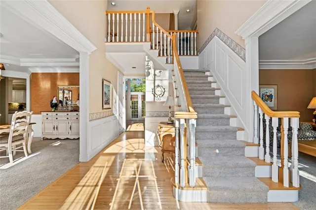 a view of entryway and hall with wooden floor