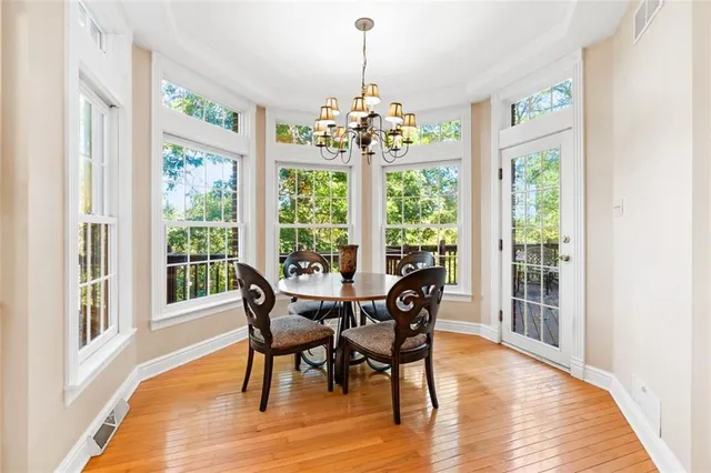 a view of a dining room with furniture window and wooden floor