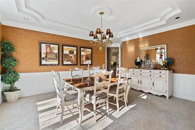 a view of a dining room with furniture and window