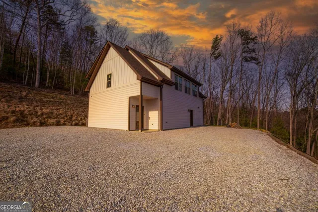 a front view of a house with parking space