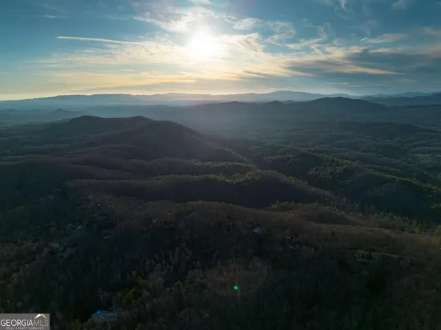 a view of a kitchen with a sink and windows