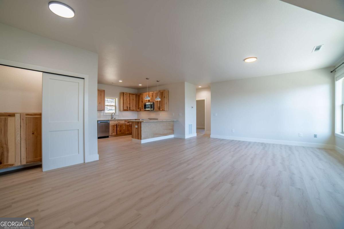 802 Mull Valley Road Morganton, GA 30560 - Photo 30 of 75 a view of a kitchen with a sink and a refrigerator