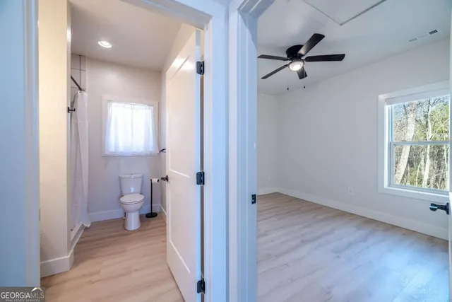 a kitchen with granite countertop a sink stainless steel appliances and cabinets