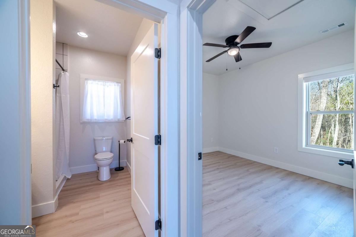 802 Mull Valley Road Morganton, GA 30560 - Photo 33 of 75 a view of a hallway with a hardwood and a bathroom