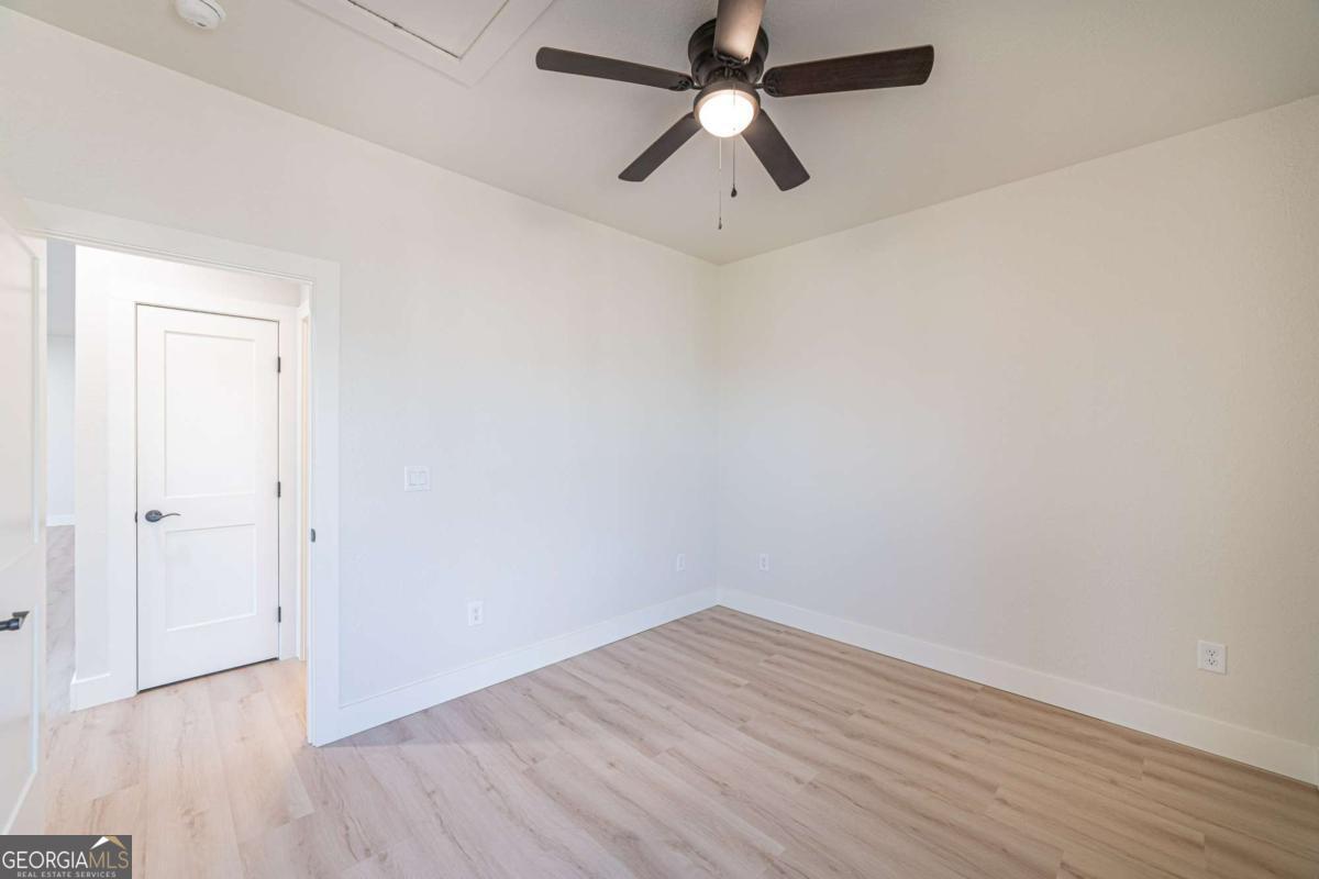 802 Mull Valley Road Morganton, GA 30560 - Photo 36 of 75 an empty room with wooden floor and windows