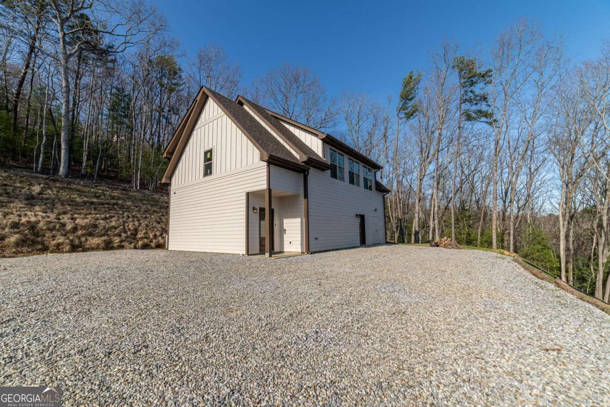 802 Mull Valley Road Morganton, GA 30560 - Photo 44 of 75 a front view of a house with a yard and garage