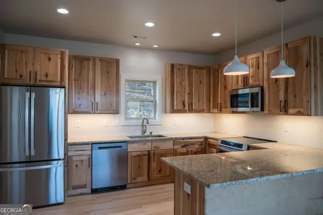 a view of a garden with plants and trees