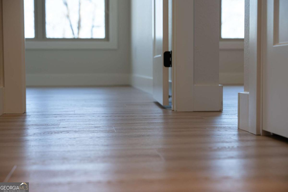 802 Mull Valley Road Morganton, GA 30560 - Photo 59 of 75 a view of empty room with wooden floor and fan