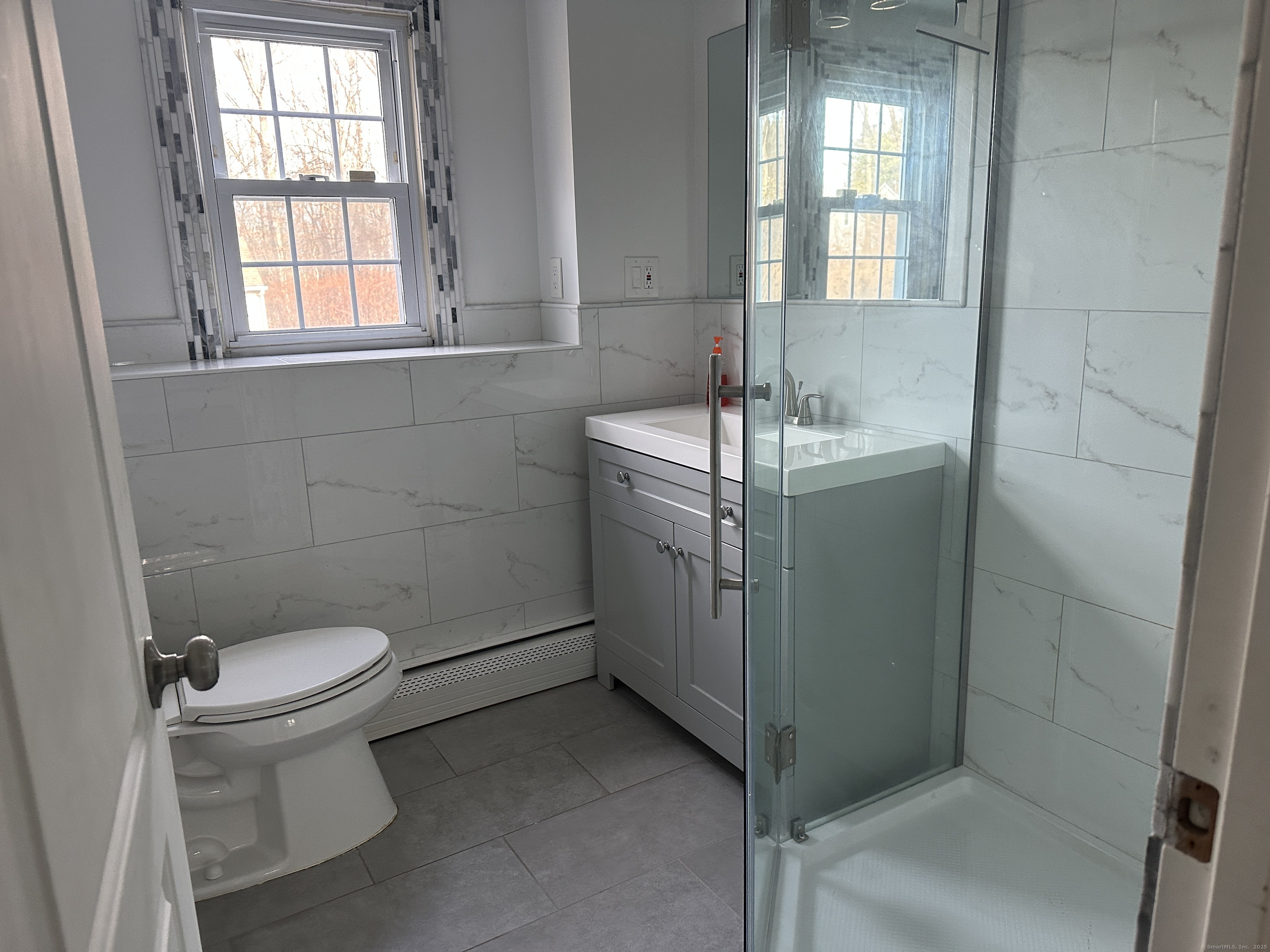 65 Gate Ridge Road Easton, CT 06612 - Photo 12 of 15 a bathroom with a sink toilet and window