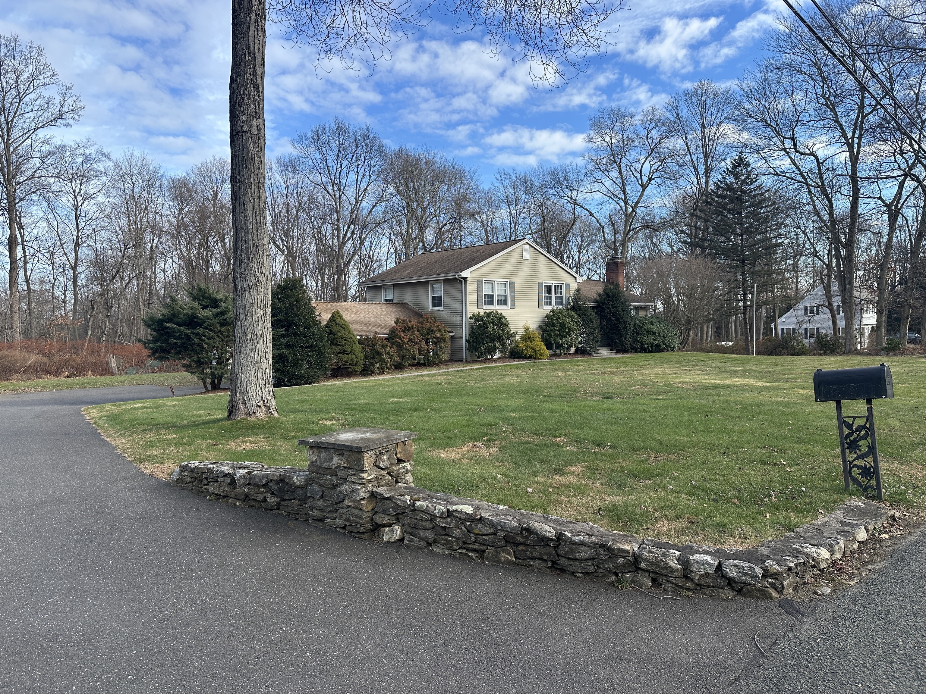 65 Gate Ridge Road Easton, CT 06612 - Photo 2 of 15 a view of a house with a yard and garage
