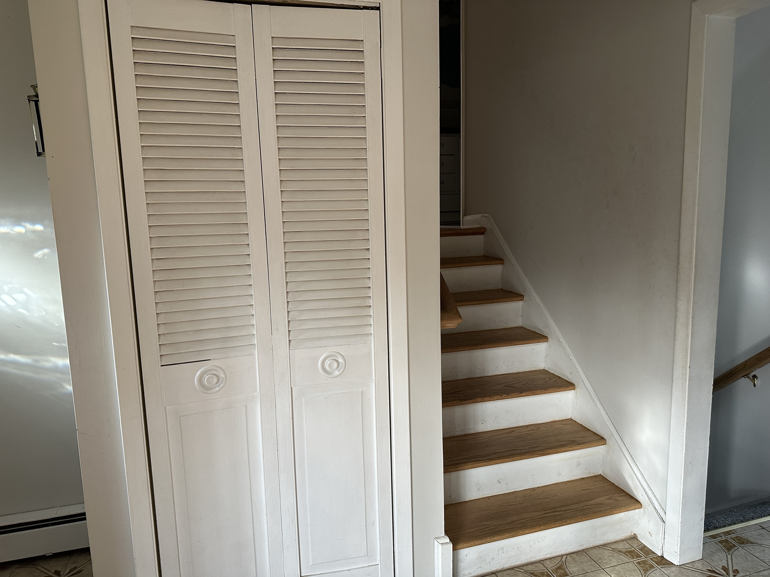 65 Gate Ridge Road Easton, CT 06612 - Photo 6 of 15 a view of staircase with white walls and a window