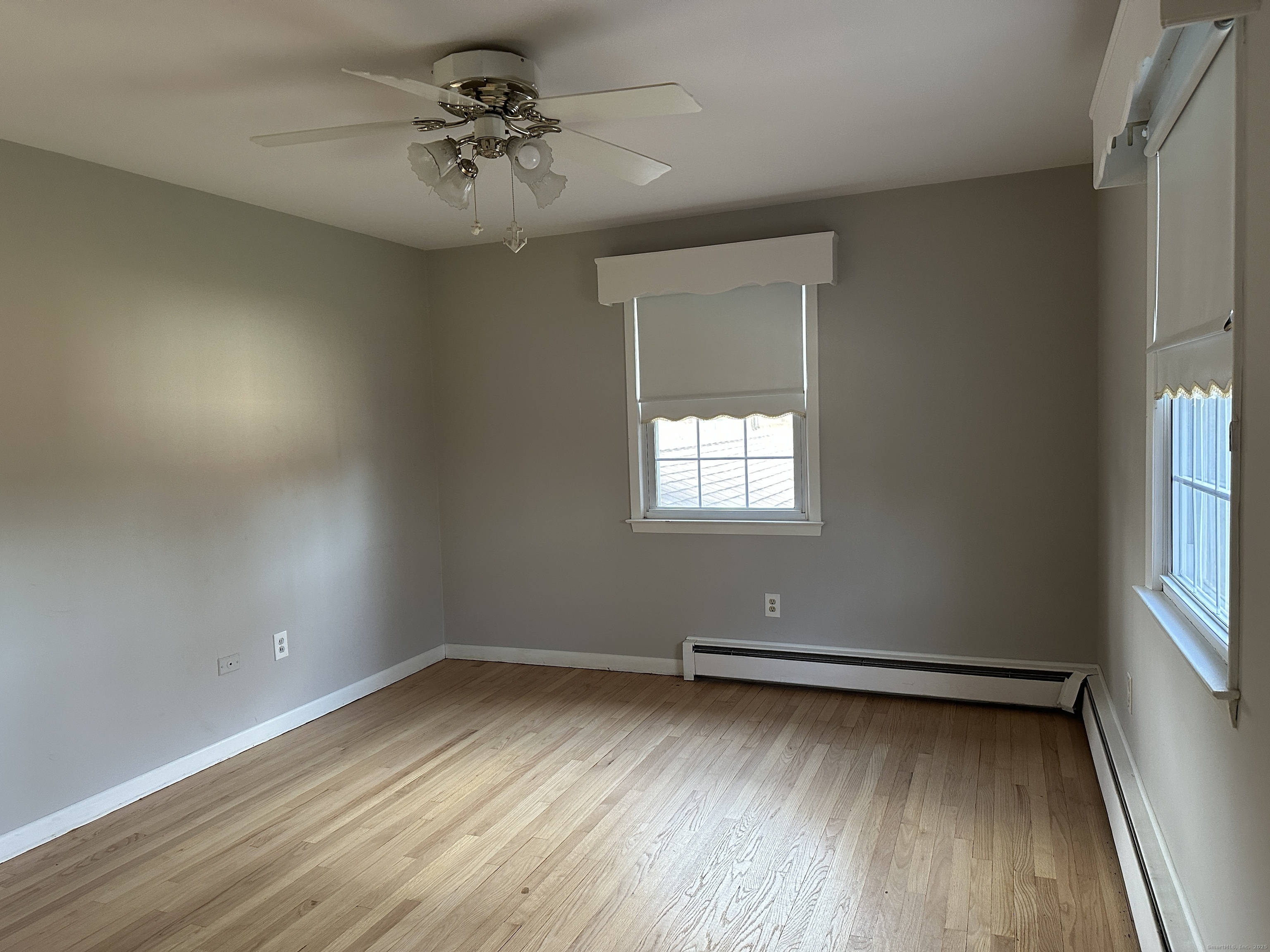 65 Gate Ridge Road Easton, CT 06612 - Photo 7 of 15 wooden floor in an empty room with a window