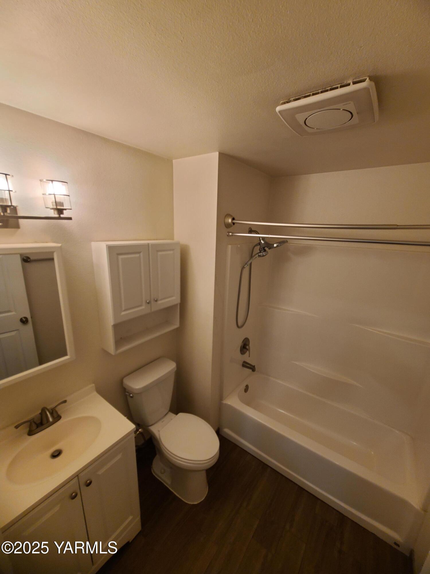 9509 Meadowbrook Road Yakima, WA 98903 - Photo 11 of 14 a bathroom with a sink a toilet and shower