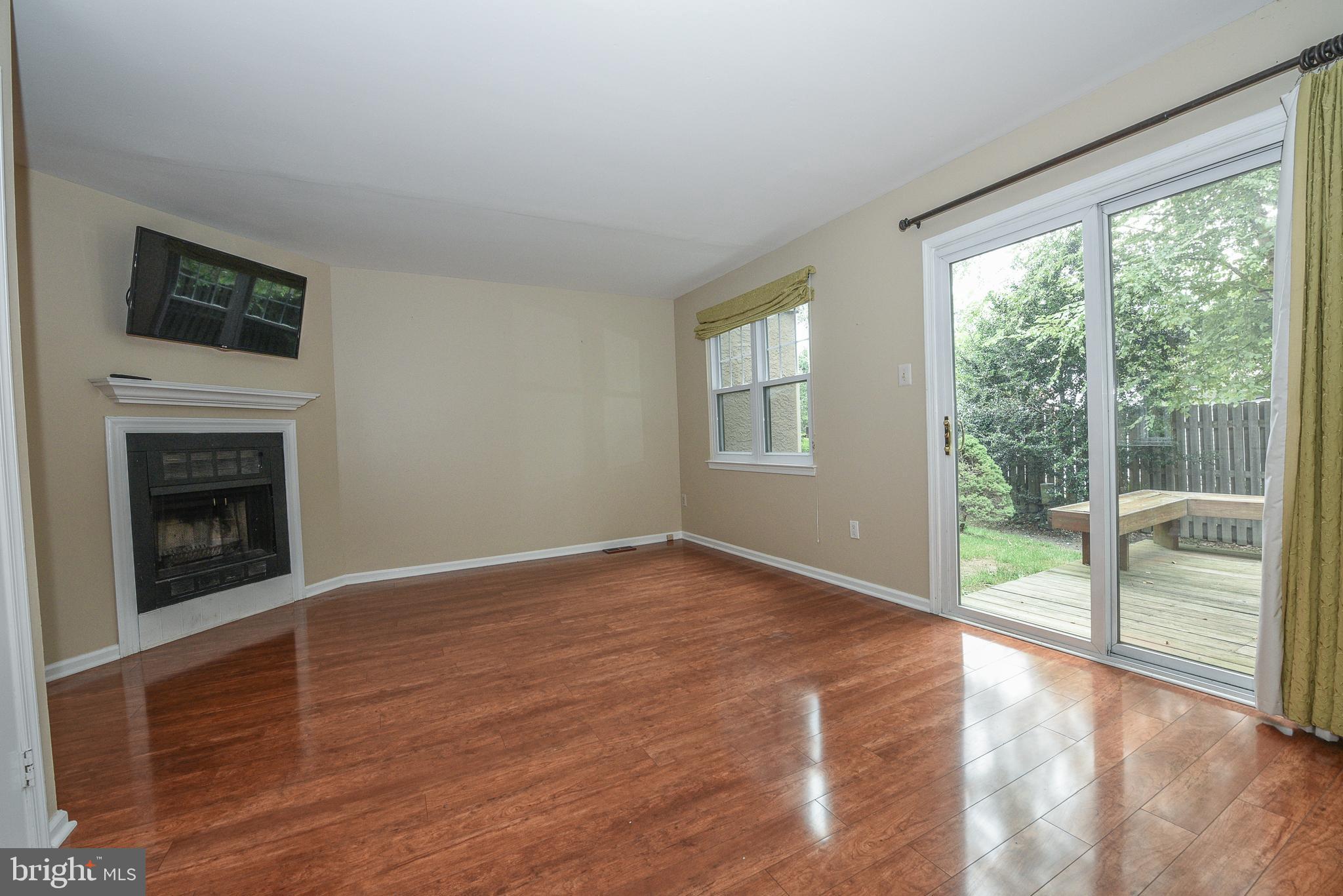429 Eagle Road Wayne, PA 19087 - Photo 12 of 41 a view of an empty room with wooden floor and a window