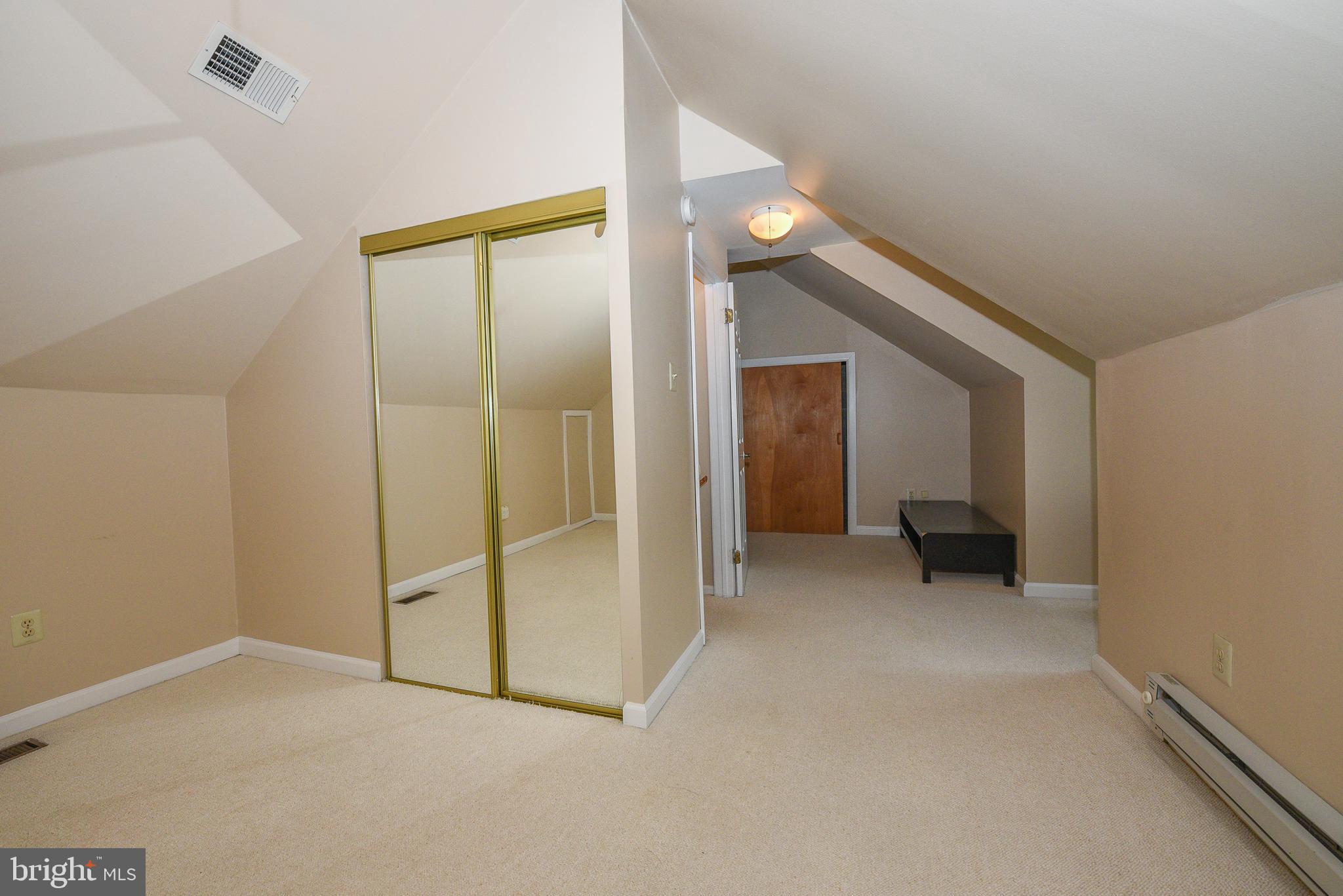 429 Eagle Road Wayne, PA 19087 - Photo 30 of 41 an empty room with closet and a hallway