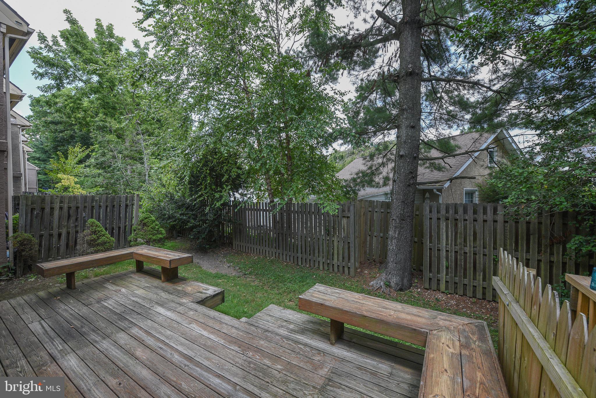 429 Eagle Road Wayne, PA 19087 - Photo 34 of 41 a wooden bench sitting next to a lake