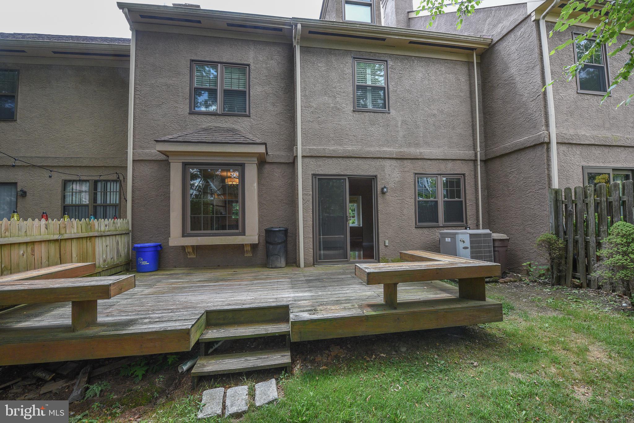 429 Eagle Road Wayne, PA 19087 - Photo 35 of 41 a wooden bench sitting in front of a house