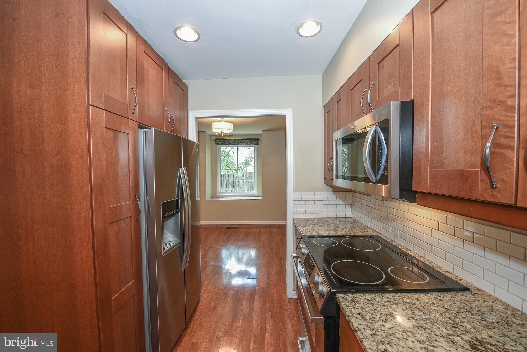 429 Eagle Road Wayne, PA 19087 - Photo 8 of 41 a kitchen with a refrigerator and a sink