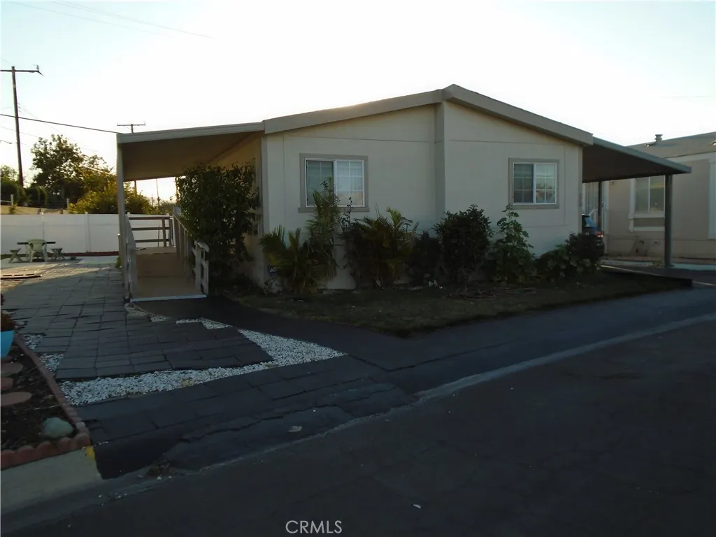 3700 Buchanan Street, Unit 38 Riverside, CA 92503 - Photo 1 of 1 a front view of a house with garden