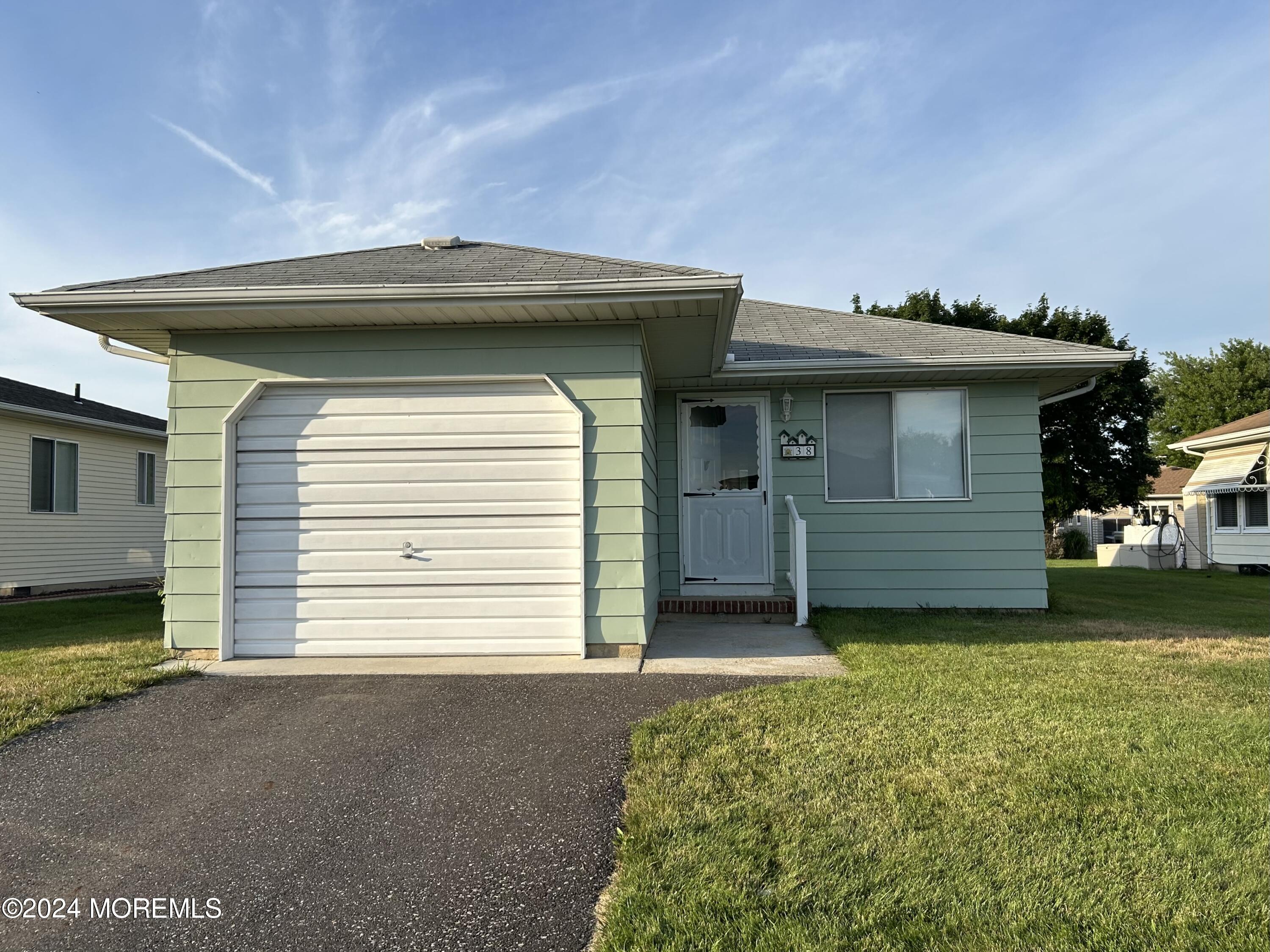 a view of a house with a garage