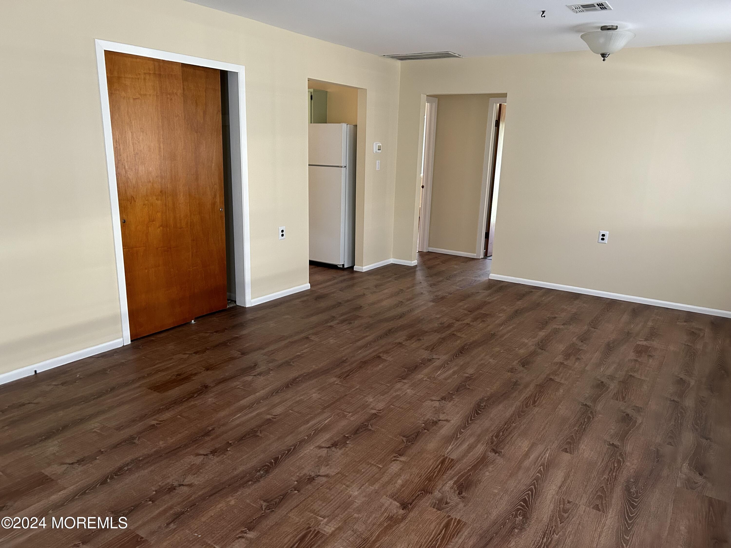 38 Eldorado Street Toms River, NJ 08757 - Photo 8 of 11 an empty room with wooden floor and closet