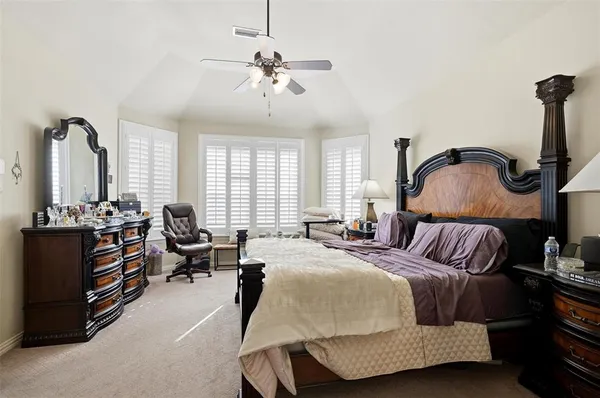 a bedroom with bed and window
