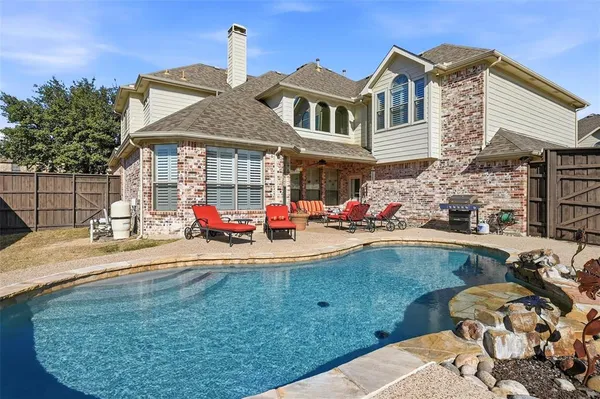 a view of a house with a swimming pool