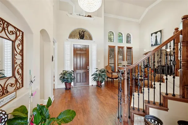 a view of front door and porch with wooden floor