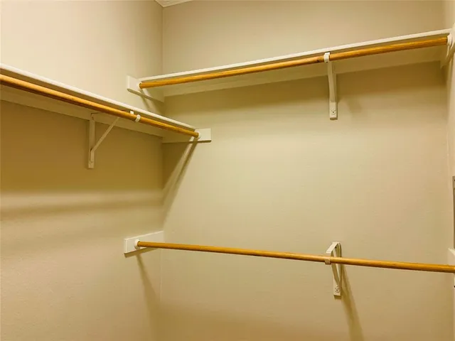 a kitchen with stainless steel appliances granite countertop a refrigerator a stove top oven a sink and dishwasher