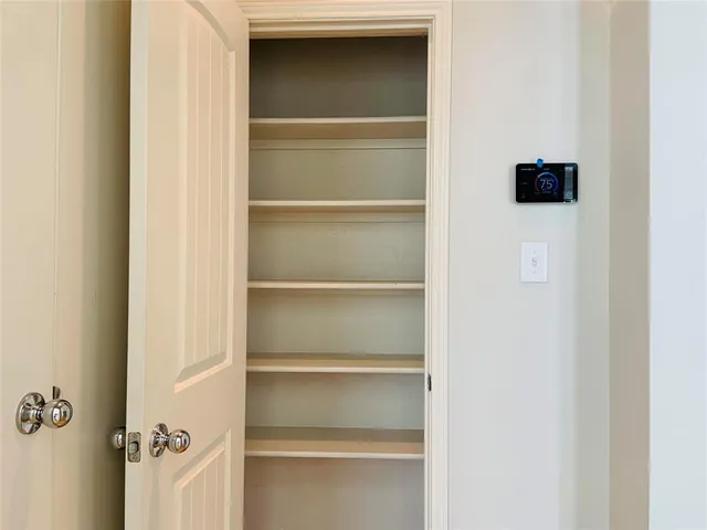 a kitchen with stainless steel appliances kitchen island granite countertop a refrigerator and a stove top oven