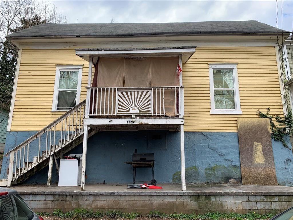 1147 Hubbard Street Southwest Atlanta, GA 30310 - Photo 2 of 2 a front view of a house with garage