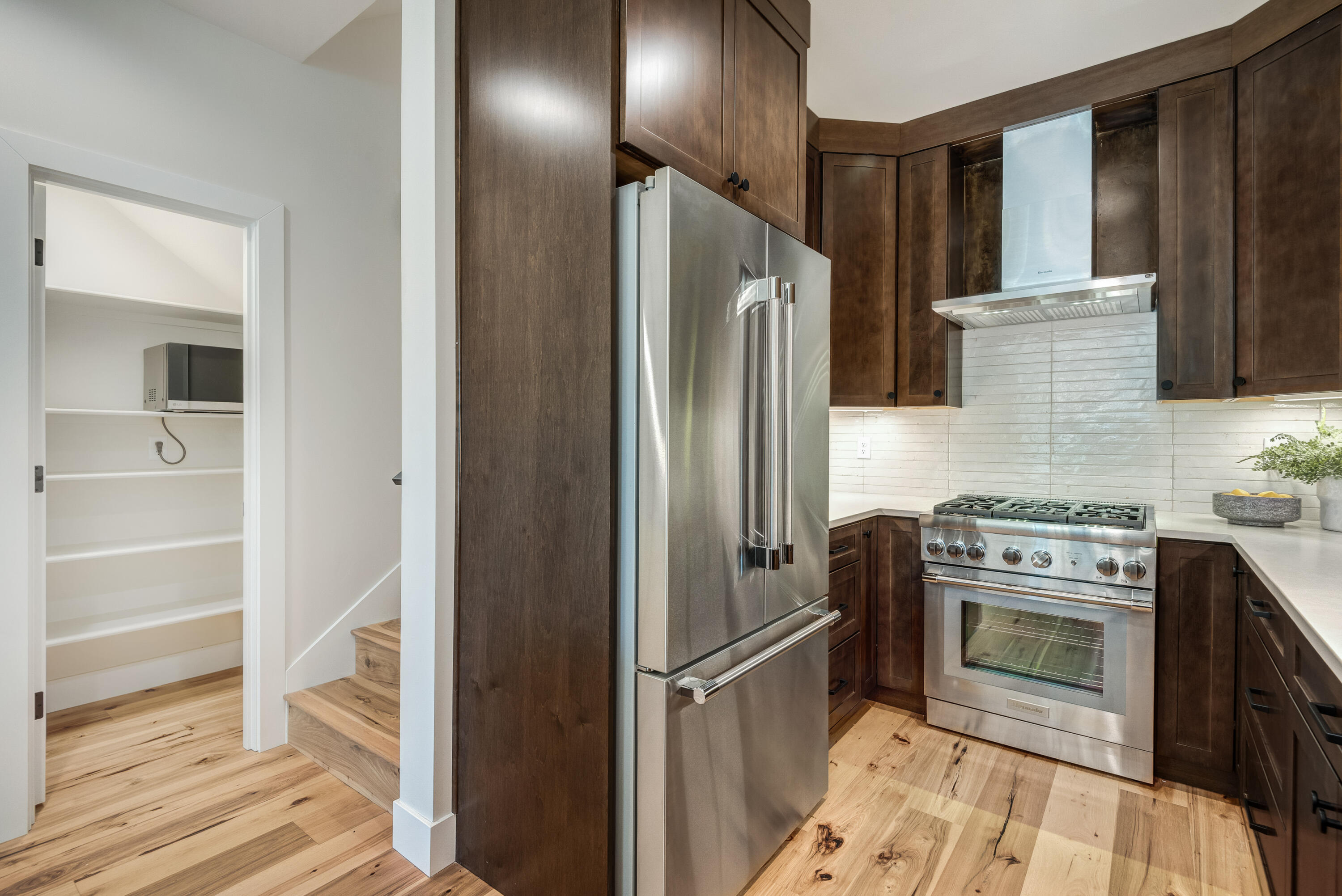 334 Southwest Roosevelt Avenue, Unit 4 Bend, OR 97702 - Photo 11 of 22 a kitchen with a stove refrigerator and cabinets