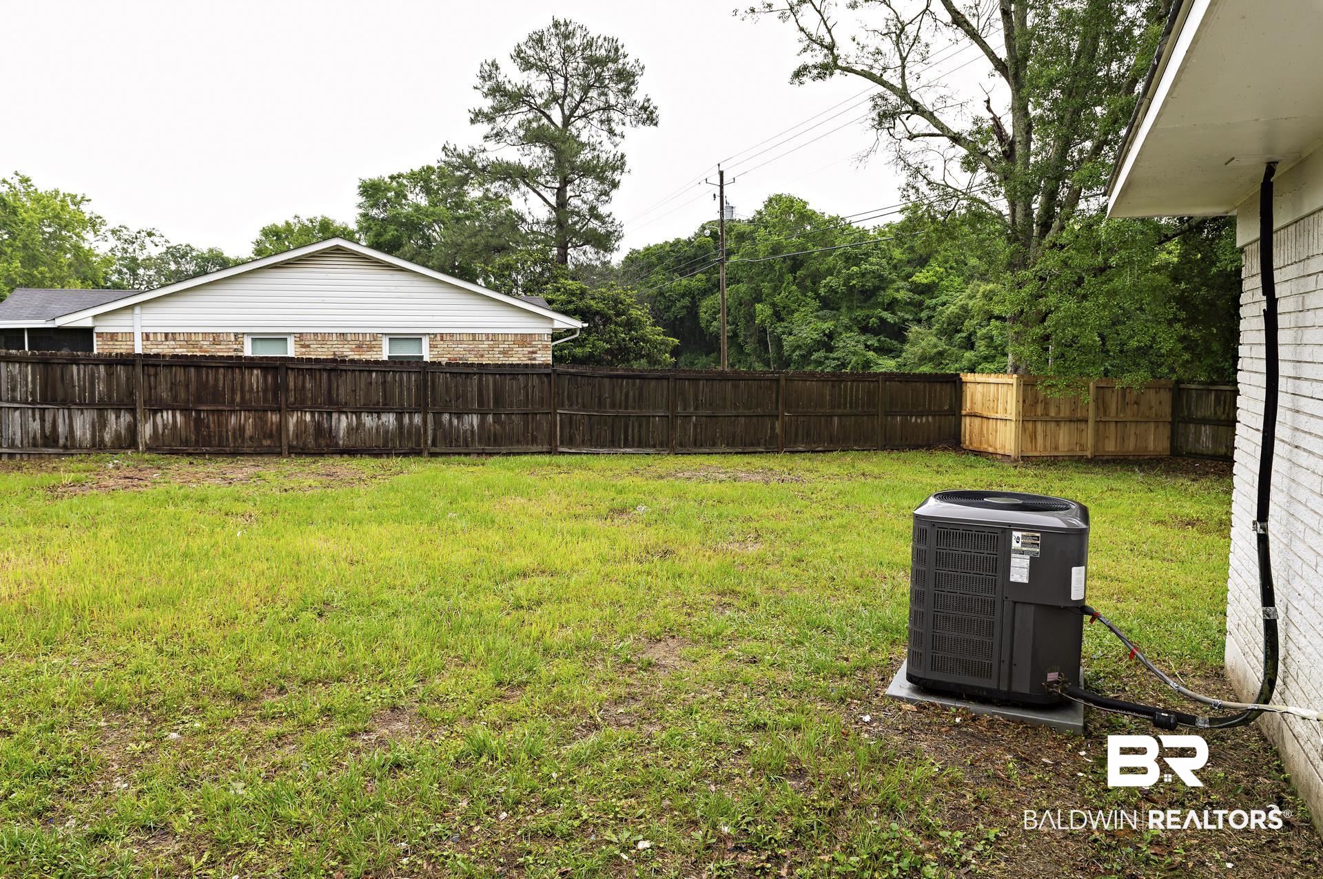 5922 Sunnyside Drive Mobile, AL 36619 - Photo 45 of 51 View of yard with central AC unit