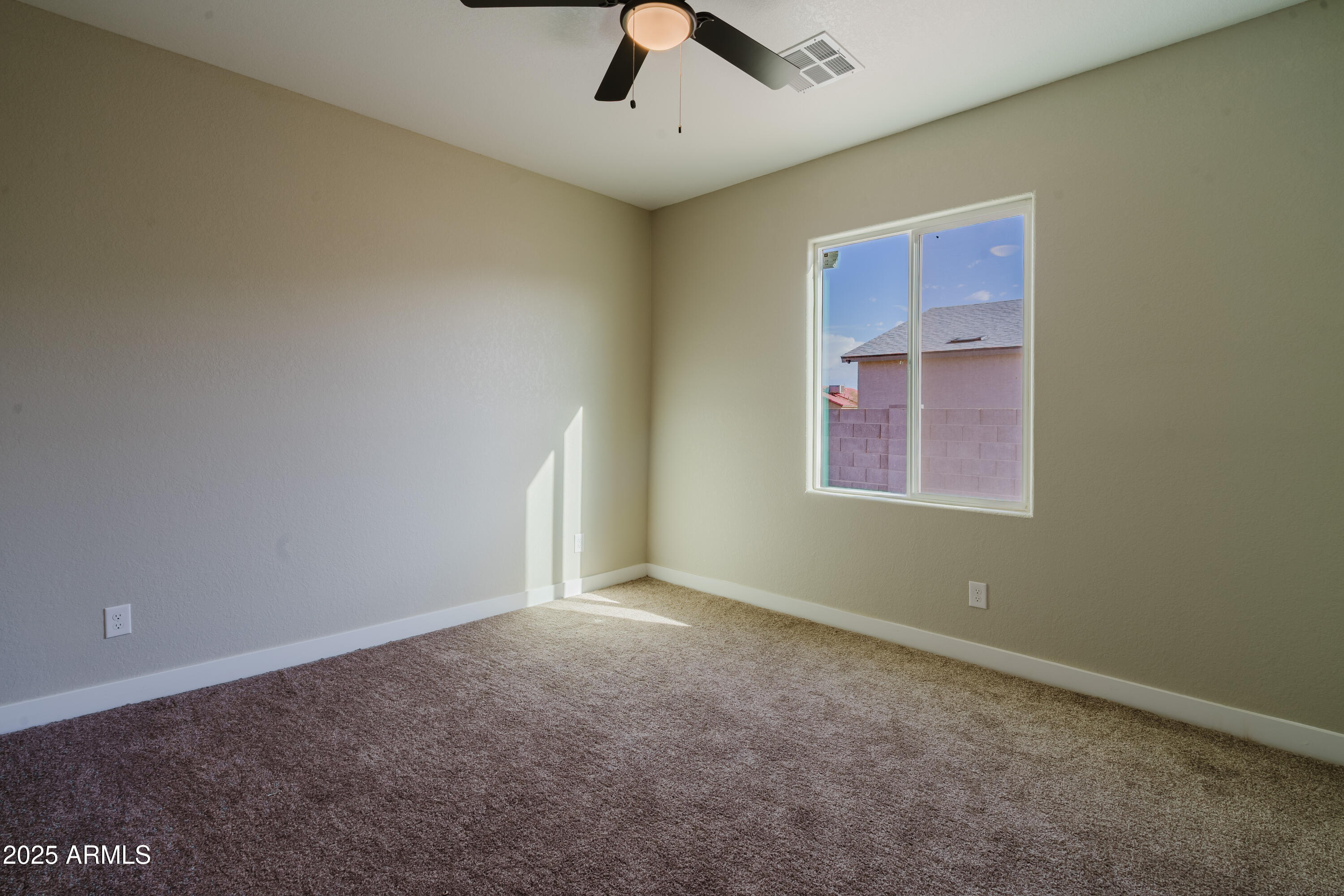 14951 South Capistrano Road Arizona City, AZ 85123 - Photo 13 of 27 an empty room with chandelier fan